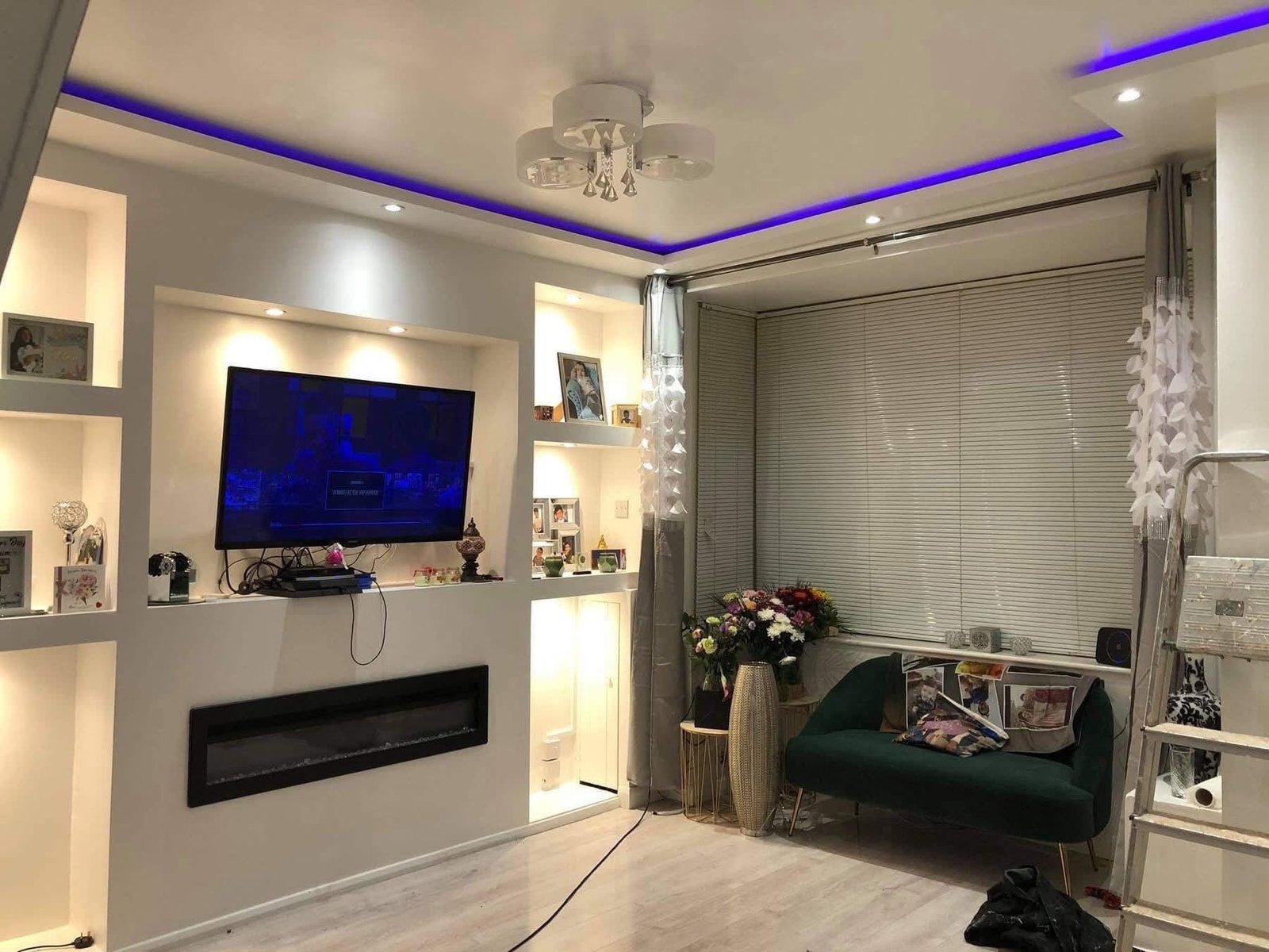 Finished living room with media wall, alcoves and LED coving