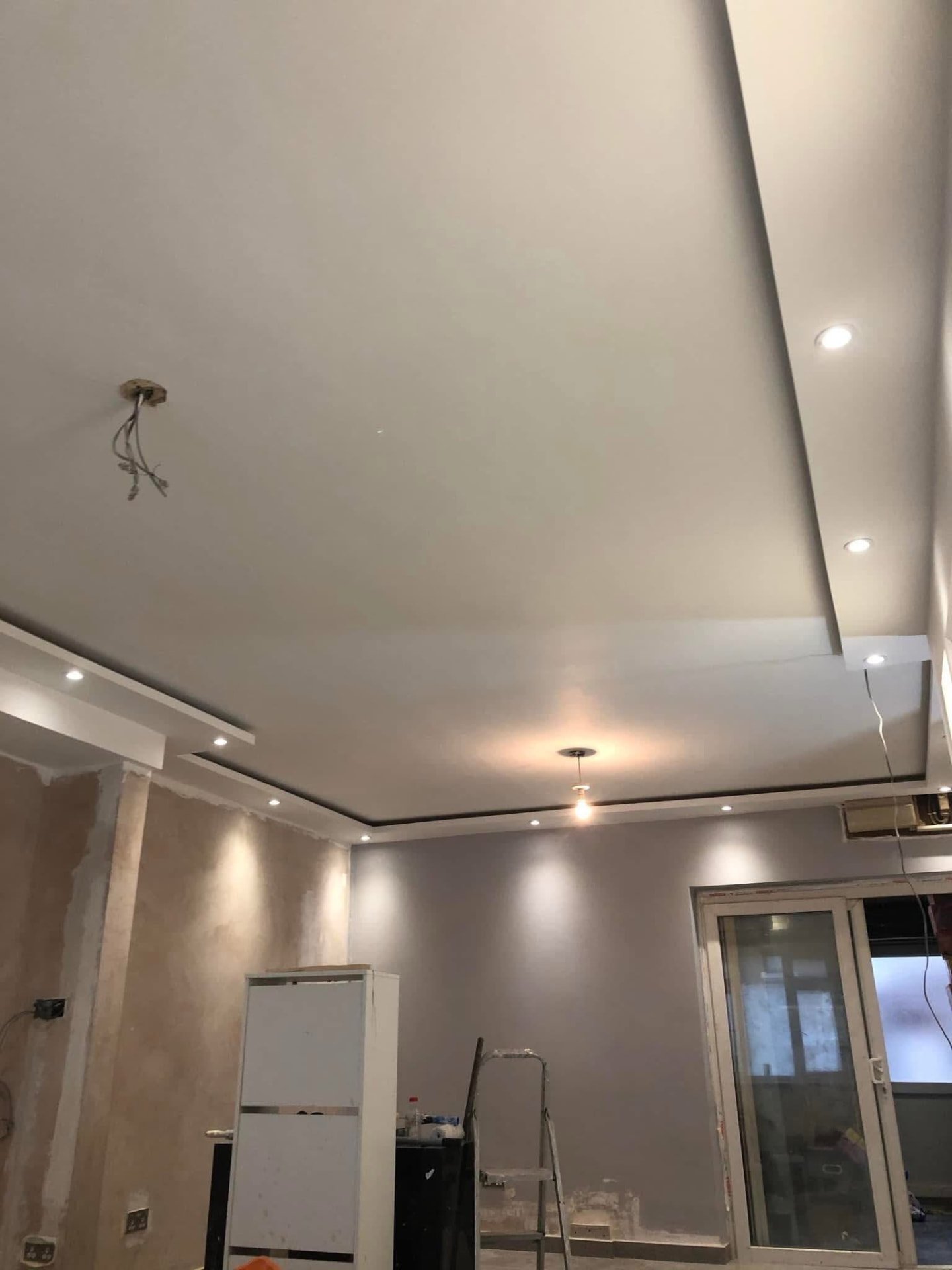 Freshly skimmed ceiling and walls with recessed lighting